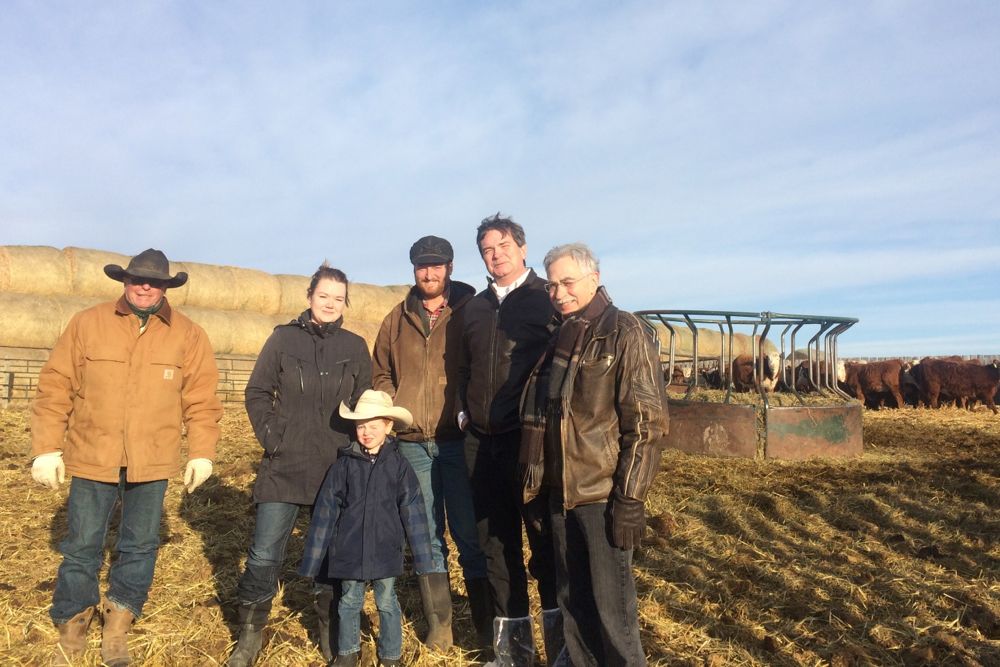 Alberta’s provincial Agriculture Minister Oneil Carlier and Medicine Hat MLA Bob Wanner (r) met Dec. 21 with producers affected by the bovine tuberculosis outbreak near Jenner, about 75 km northeast of Brooks. (Government of Alberta photo)
