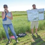 Flax Council of Canada agronomist Rachel Evans, shown here at left at a test plot site near Melita, Man. in July 2017, was the council’s most recent hire. (Manitoba Co-operator photo by Alexis Stockford)
