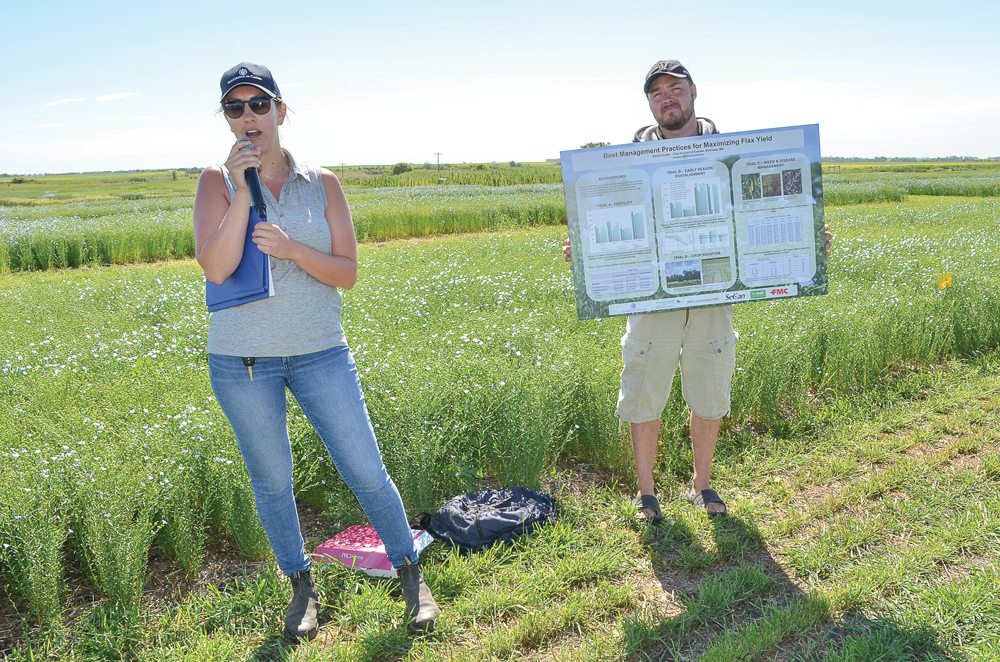 Flax Council of Canada agronomist Rachel Evans, shown here at left at a test plot site near Melita, Man. in July 2017, was the council’s most recent hire. (Manitoba Co-operator photo by Alexis Stockford)
