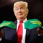 U.S. President Donald Trump holds “Make Our Farmers Great Again” hats during a “Make America Great Again” rally in Evansville, Indiana on Aug. 30, 2018. (Photo: Reuters/Kevin Lamarque)