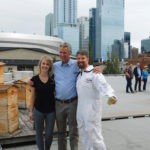Flow Hive co-creator Stuart Anderson (flanked by MacEwan sustainability director Kalen Pilkington and beekeeper Troy Donovan) checks
out his creation on the roof of one of the university’s downtown buildings.