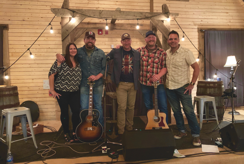 Blake Reid (second from left) with fellow Alberta songwriters Joni Delaurier, Duane Steele, Dustin Farr, and Troy Kokol.