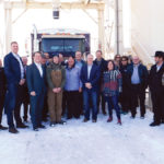 A group of farmers, government and industry officials pose at Tri M Farms near Bon Accord after the unveiling of new workplace safety legislation.