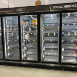 The photos on this page offer three very different views of what’s happening during the pandemic — nearly empty dairy shelves at St. Albert grocery store on March 16, a truck coming over the Seaway International Bridge from the U.S. on March 25 after border restrictions were imposed (see below), and cleaning wheat seed on John Kowalchuk’s Rumsey-area farm on March 30 (see below). While empty shelves are a worrying sight, essential goods are coming over the border and the country’s farmers are doing everything they can to ensure there are no disruptions to the food supply.