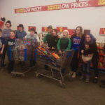 Members of the Fort Saskatchewan 4-H Beef Club at Santas Anonymous in December.