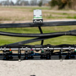 The back side of a standard New Holland boom retrofitted with the WEED-IT Quadro. Retailer Croplands Equipment sells the Quadro in either a retrofit kit which allows it to be installed on most types of existing sprayer booms or as a 120-foot Millennium boom.