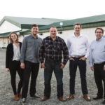 Evert Beyer and wife Jannie (not pictured) emigrated from the Netherlands in 1994 and began dairy farming six years later. The family still milks cows but cheese making and retailing have become a major part of the family enterprise, which includes (from left) siblings Jocelyn, Harvey and Jacco (with sales manager Chad Carbno on the right). Another son, Theo, helps run the dairy farm.