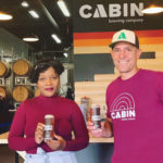 Marion Ashton, executive director of Sankofa Arts and Music Foundation, shares a Black is Beautiful beer with Haydon Dewes, owner of Cabin Brewing. The black forest coffee stout was brewed in support of the Black Lives Matter movement and will raise $20,000 for Sankofa.