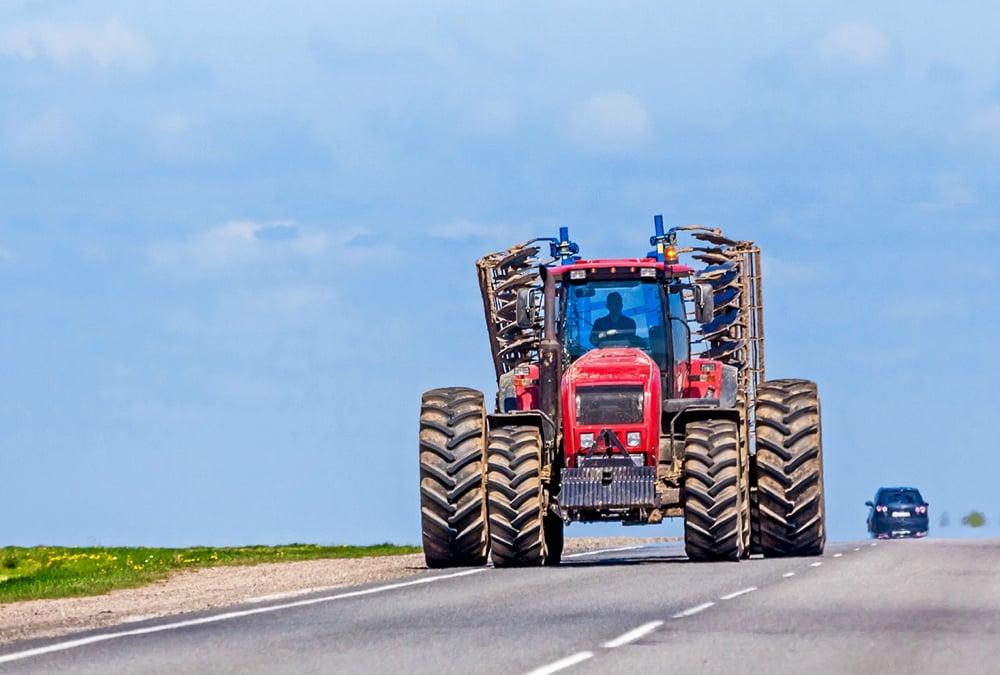 Even in the best of circumstances, moving farm equipment on highways carries risks.
