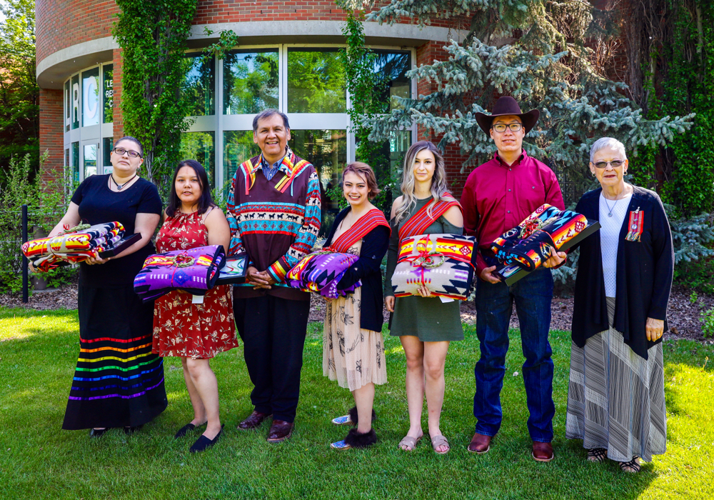 Indigenous students at Olds College participated in an eagle feather ceremony as part of convocation.