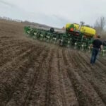 The Olson family has been seeding some canola with a corn planter on their operation near Pine Lake for the past two years. But this year will be the real test as they plan to plant all their canola this way.