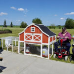 Evelyn Boddez, Don Campbell and Gordon Perrott (on right) pose with their chicken coop. Their families purchased the coop and the four hens, that were an instant hit at the West Country Hearth seniors’ residence in Villeneuve.