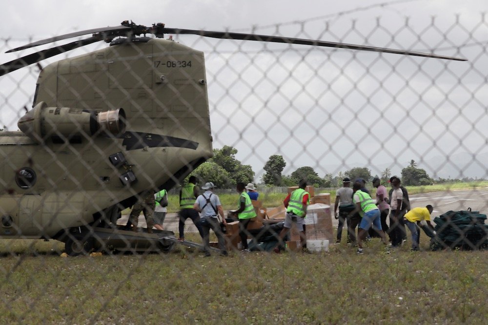 Workers unload humanitarian aid from a U.S. military helicopter at the airport at Les Cayes, Haiti on Aug, 18, 2021 after Saturday’s 7.2 magnitude earthquake. (Photo: Reuters/Henry Romero)
