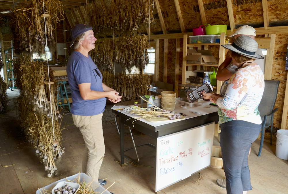 “Every time someone new tastes it, we get new customers,” says Lorraine Bannister (left), who began growing garlic as a retirement project with husband Kevin.