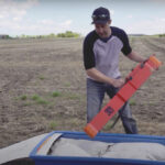 Soil electrical conductivity data can reveal a lot about a field, says Lewis Baarda, seen here placing an instrument called an EM38 in a sled prior to field mapping.