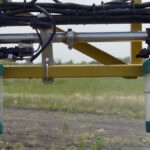 This image from an Intelligent Ag Solutions video shows a partially blocked nozzle (on left) can drastically reduce the volume of spray.