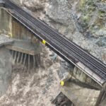 An aerial view shows a damaged road as a flood sweeps through, near Lytton, B.C. on Nov. 15, 2021. (Handout photo from B.C. Ministry of Transportation and Infrastructure via Reuters)