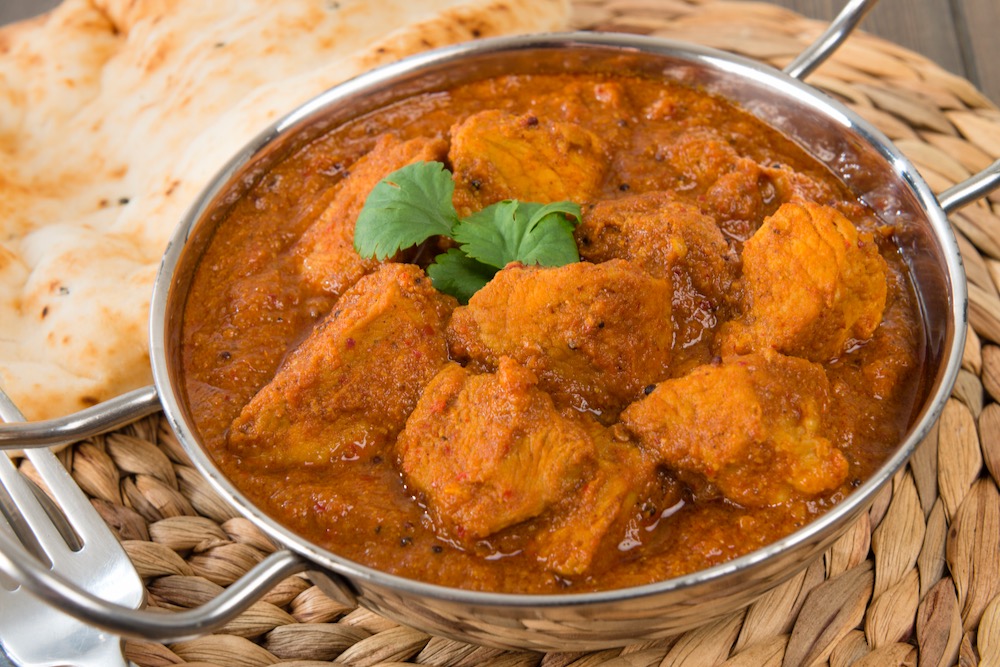 Indian pork curry with naan bread. (Paul_Brighton/iStock/Getty Images)

