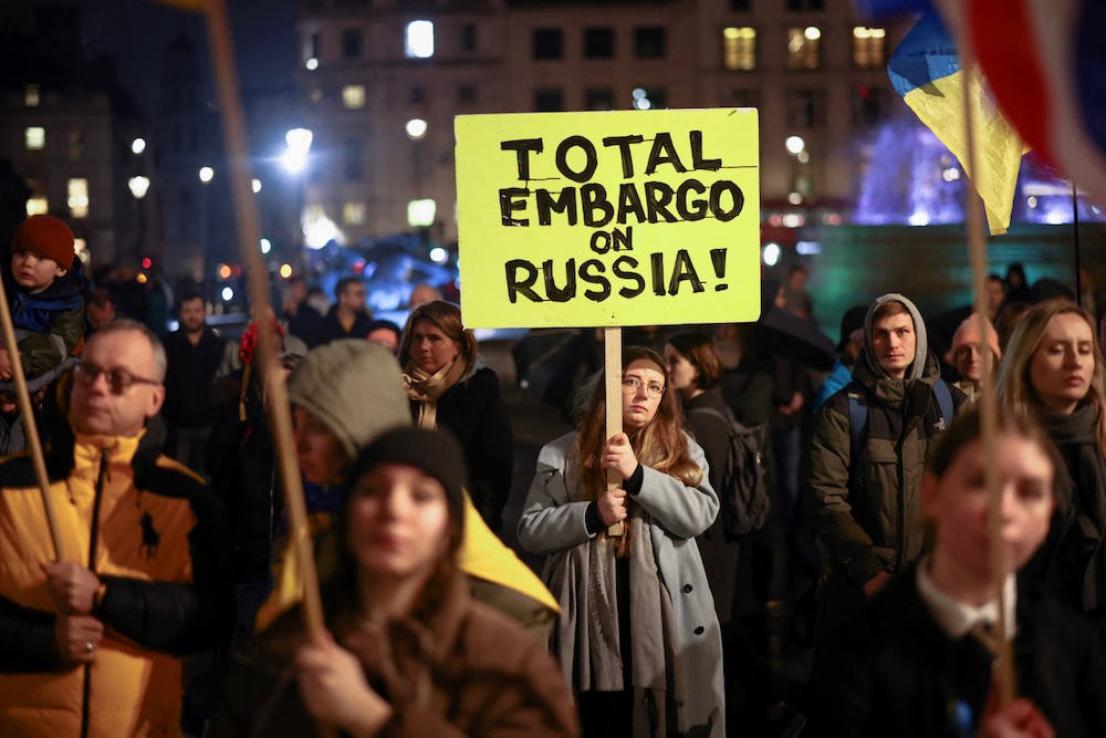 A woman holds a sign during a protest against Russia's invasion of Ukraine, at Trafalgar Square in London, Britain Mar. 4. 
