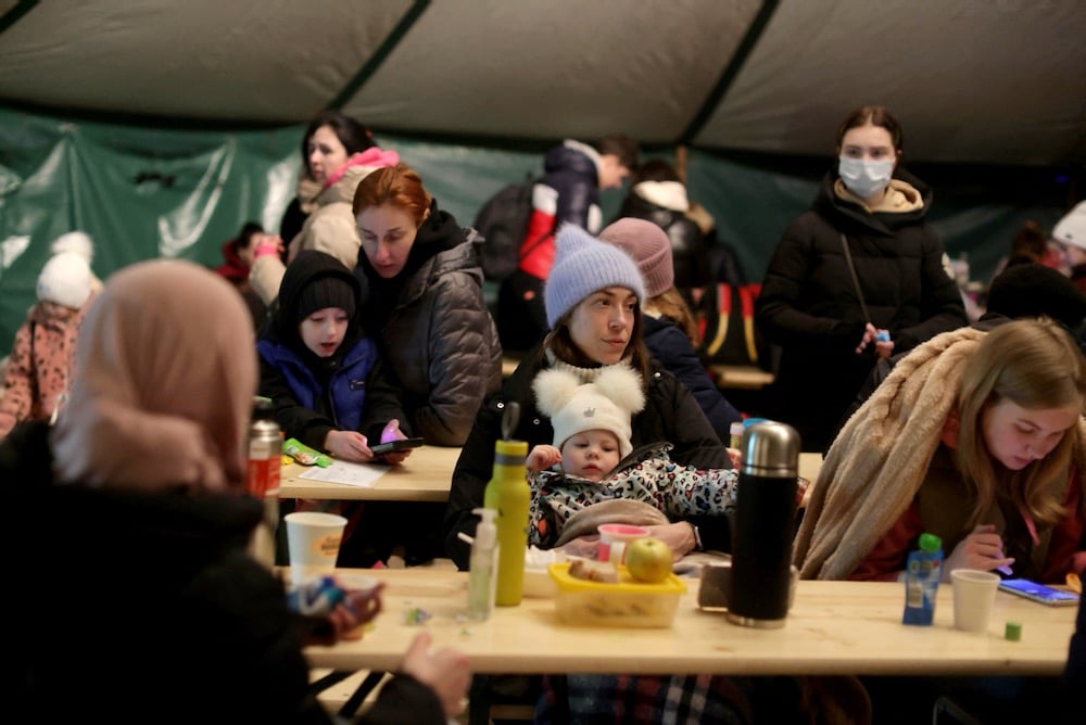 Refugees from Ukraine wait the Ukrainian-Slovakian border following Russia's invasion of Ukraine, in Vysne Nemecke, Slovakia, Mar. 4, 2022.