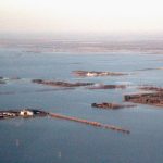 An aerial view of flooded farmland near Rosenort, Man., about 50 km south of Winnipeg, on May 6, 2022. (Manitoba Co-operator photo by Allan Dawson)