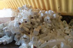 File photo of agricultural plastic containers collected for recycling.