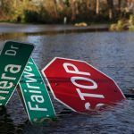 After Hurricane Ian made landfall in southwestern Florida, a street sign lies in flood waters at Punta Gorda, about 40 km north of Fort Myers, on Sept. 29, 2022. (Photo: Reuters/Shannon Stapleton)