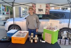 Producers in Alberta are showing that sustainable agriculture practices work, says Austin Noirot, pictured here at the Innisfail Farmers Market selling products from his family’s operation, B lazy S Cattle Company.
