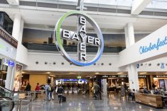 Bayer&#8217;s cross symbol hangs in a terminal at Frankfurt International Airport. (Typhoonski/iStock Editorial/Getty Images)

