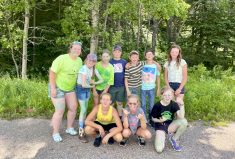 Alberta 4-H summer program co-ordinator Candace Halvorson (far left) with a group of 4-H campers in summer 2022.