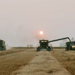 The combine team at KCL Cattle Company hard at work last fall. Co-owner Karleen Clark says a harvest free of weather delays — and as a result, virtually non-stop combining — helped create a recipe for worker fatigue.