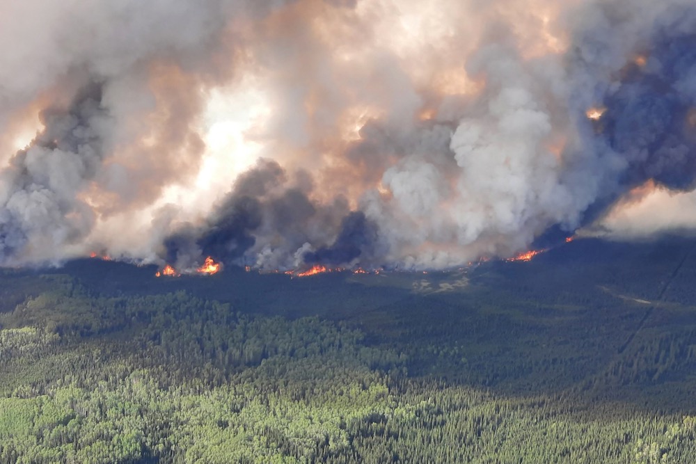 Smoke rises from a wildfire southeast of Fort Nelson in northeastern B.C. on May 27, 2023. (Photo: B.C. Wildfire Service/Handout via Reuters)
