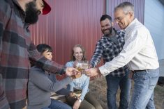 Members of the Hamill family toast the success of Red Shed Malting with glasses of whisky made from malt barley grown on the family’s Red Deer-area farm. From left to right: John, Susie, Matt, Joe and Daelyn Hamill.