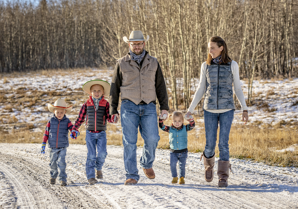 Matt and Angela Kumlin take their kids Bennett, Wade and Rachel for a stroll on their ranch near Cochrane. The Kumlins received $70,000 from the On Farm Climate Action Fund to build a pasture pipeline watering system for more efficient and sustainable grazing.