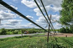 A fallen power pole on May 24, 2022 in the Quebec municipality of Saint-Hippolyte, 45 km north of Montreal, following a derecho event which is estimated to have caused more than $750 million in damages and led to the deaths of 12 people in Quebec and southern Ontario.