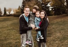 Although new Alberta Grains executive director Mike Flynn admits his knowledge of farming is limited, he believes his previous experience makes up for it. He’s pictured here with wife Joanie, daughter Shae (7) and son Maxwell (3).