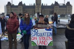Ari Westhaver of the NFU demonstrating on Parliament Hill in Ottawa on Nov. 22, 2023. (Jonah Grignon photo)
