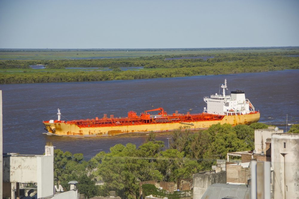 Cargo ship arriving in Rosario, Argentina. Photo: Claudiio Doenitz/iStock/Getty Images
