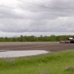 A seeding unit sits parked in a field north of Winnipeg, Man., due to wet field conditions on June, 6, 2024. Photo: Greg Berg