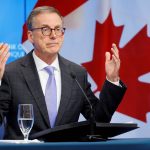 Bank of Canada cuts rates, sees weaker economy in 2024