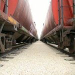 Train cars loading grain.