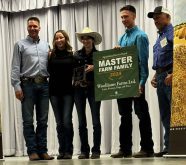 The Wolliams family posing for a photo with their Master Farm Family award.
