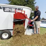 Jerry Oude Egberink, Ontario and Manitoba territory manager, releases a sheep TMR ration from the Jaylor mixer during a demonstration at Canada’s Outdoor Farm Show, Sept. 11, 2024.