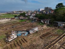 A drone view shows boats stranded on the Rio Negro as the river reached its lowest point in its history during the most intense and widespread drought the country has experienced since records began in 1950, in Manaus, Amazonas state, Brazil October 4, 2024. REUTERS/Bruno Kelly
