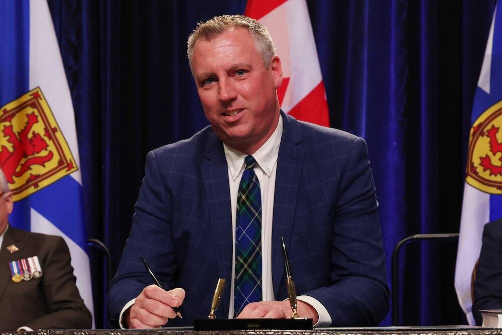 Greg Morrow signs his oath of office at a swearing-in ceremony Dec. 12, 2024 in Halifax. (Communications Nova Scotia)

