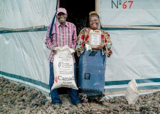 The Canadian Foodgrains Bank works with partner organizations to provide food aid and support farmers in developing countries, such as Congolese chicken farmer Rebecca (pictured – right), to grow food and support their families and communities. Photo: Canadian Foodgrains Bank/Facebook