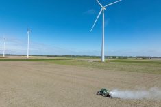 A farmer spreads agricultural lime on a field in the Netherlands. 
Liming may be an expensive treatment for acidic soils, but the return on investment in yields could make it worth the price. 