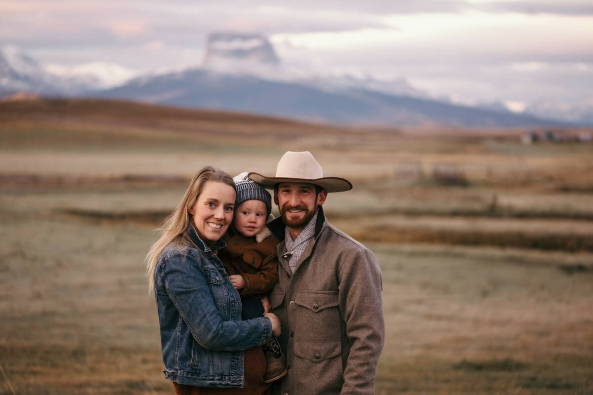 Cole Barten, pictured here with wife Jana Barten, and Kayce Barten, has worked on a ranch near Cardston for several years. This is the first year that the ranch had to deal with problem elk, who entered stackyards and destroyed bales. The elk also destroyed fences. A new provincial program allows eligible hunters to shoot problem elk.