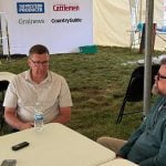 Scott Moe, left, talks to Western Producer reporter Sean Pratt at the Ag in Motion farm show near Langham, Saskatchewan. Photo: Paul Yanko
