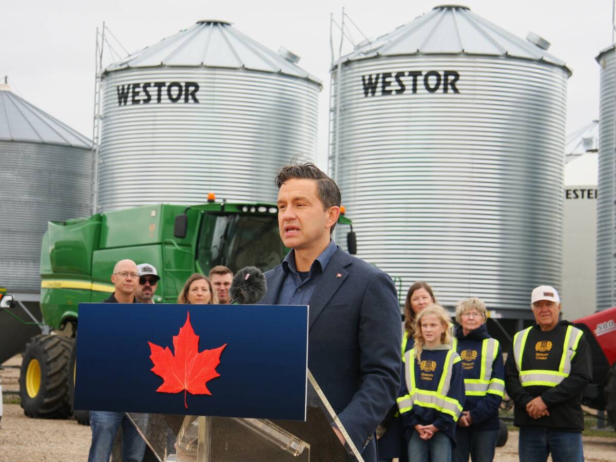 Conservative leader Pierre Poilievre addresses electric vehicles and China’s recent tariffs against Canadian canola seed at a press event on a Saskatchewan grain farm Aug. 14, 2025. Photo: Janelle Rudolph
